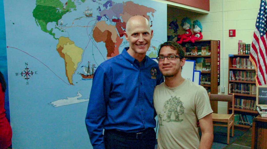 rick Scott with young boy